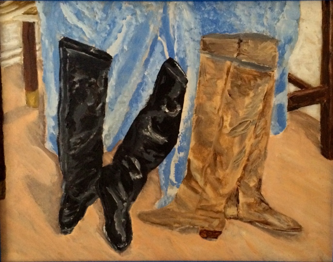 Two Pair of Boots Drying Against Blue Towel on Snowy Day